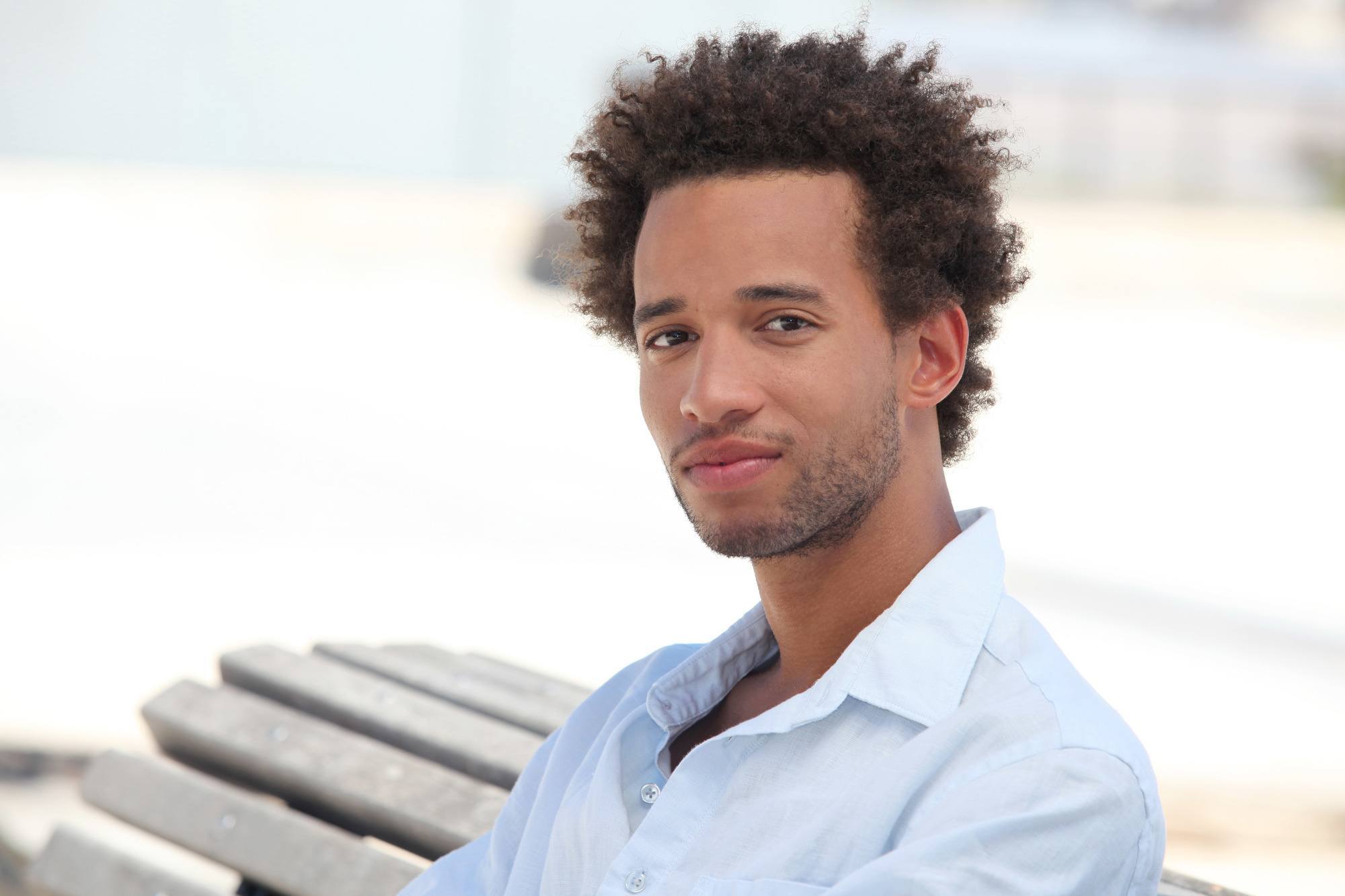fuss-free men's hairstyles: Man with natural curly hair