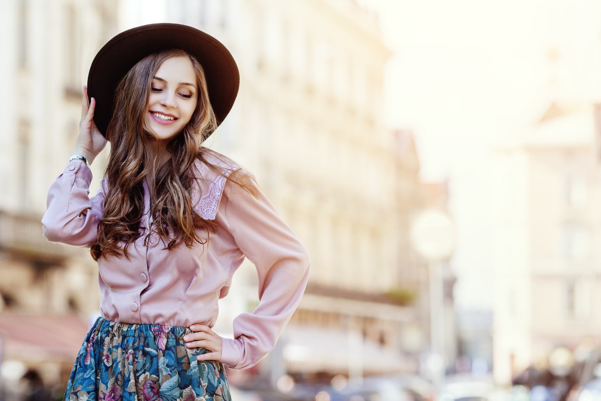 woman with Chic Hat & Long Wavy Hair