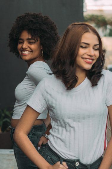 two women with medium length hair