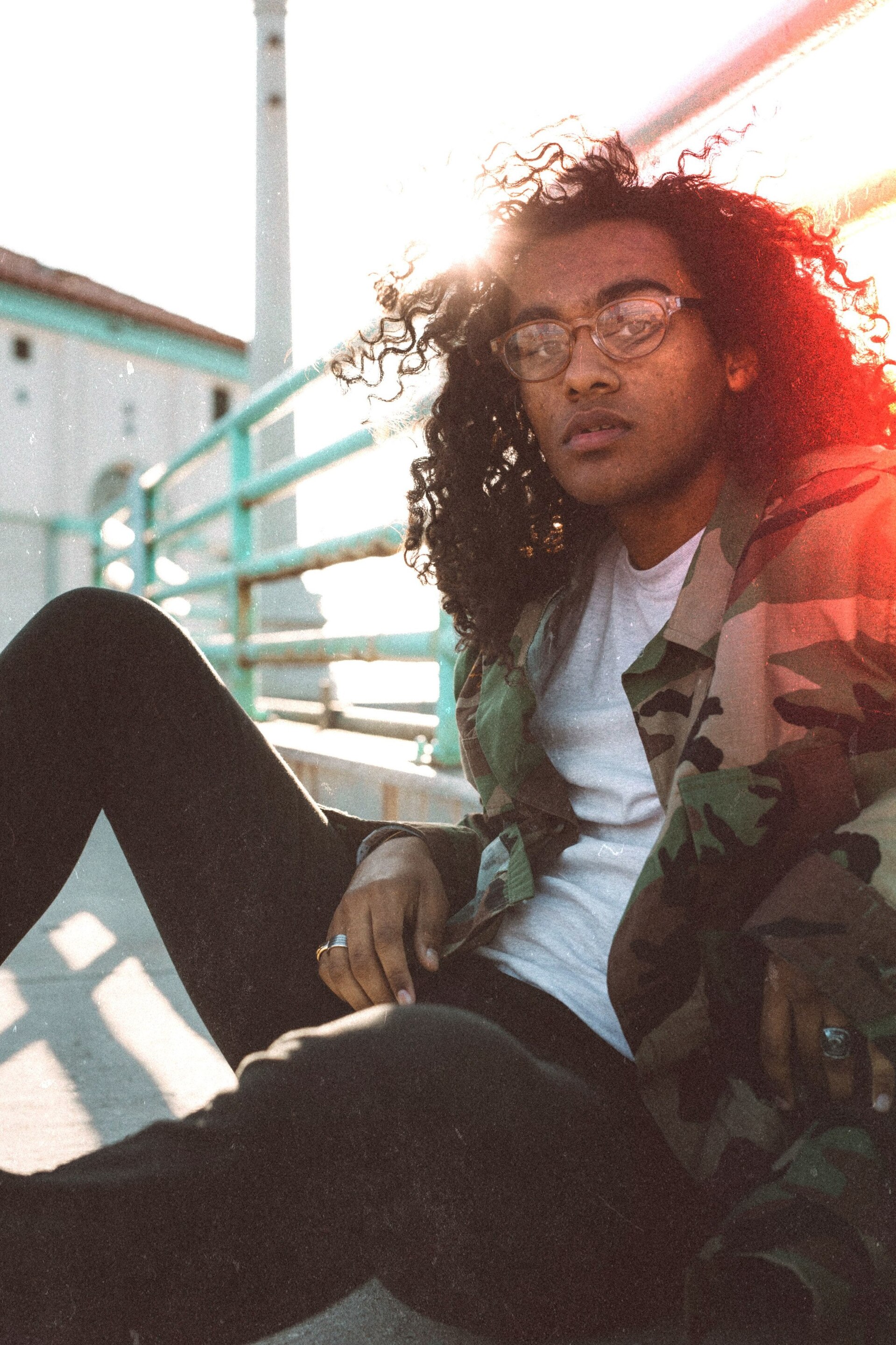 man with long curly hair