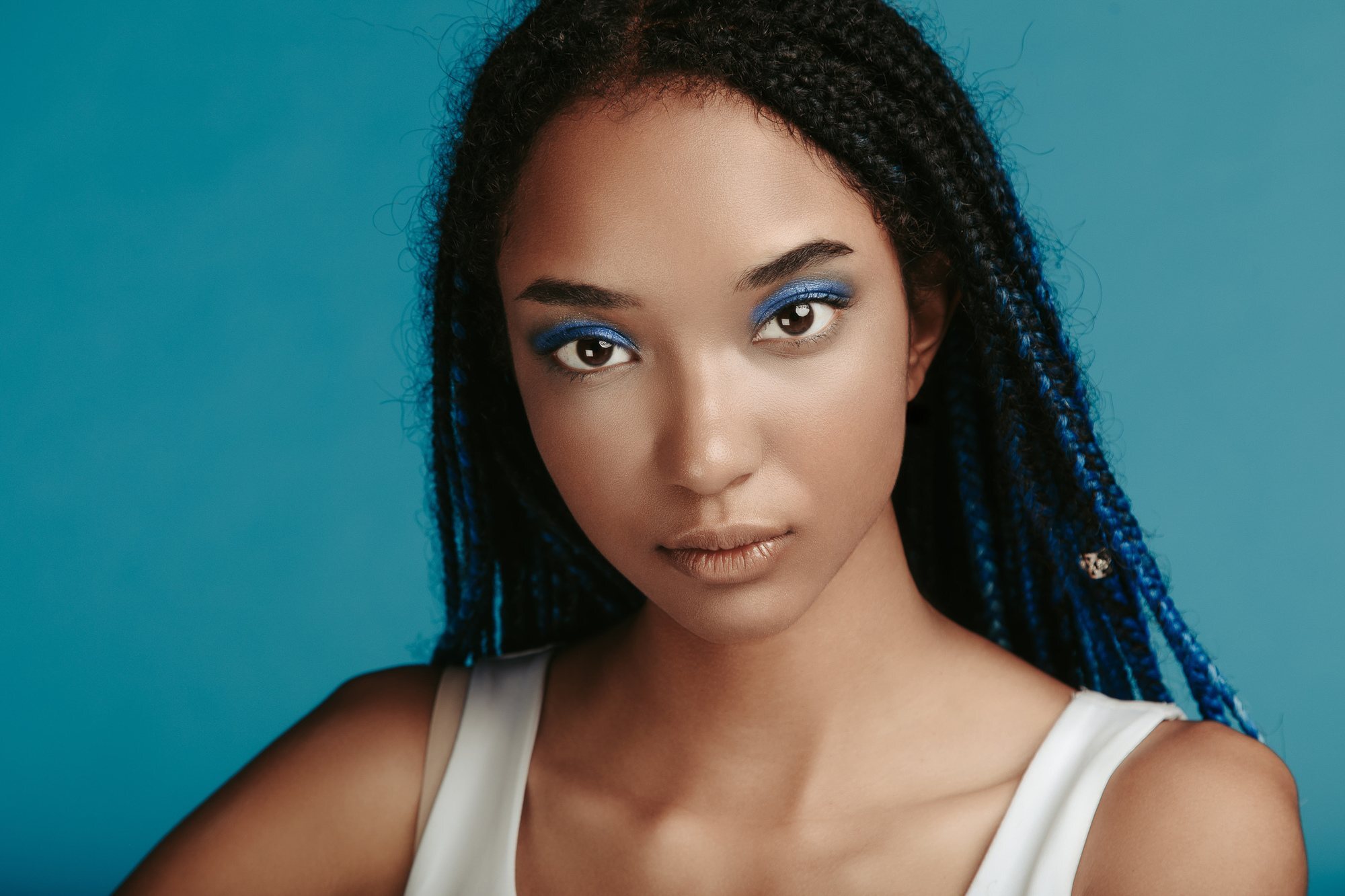 Woman with blue streaks in braids