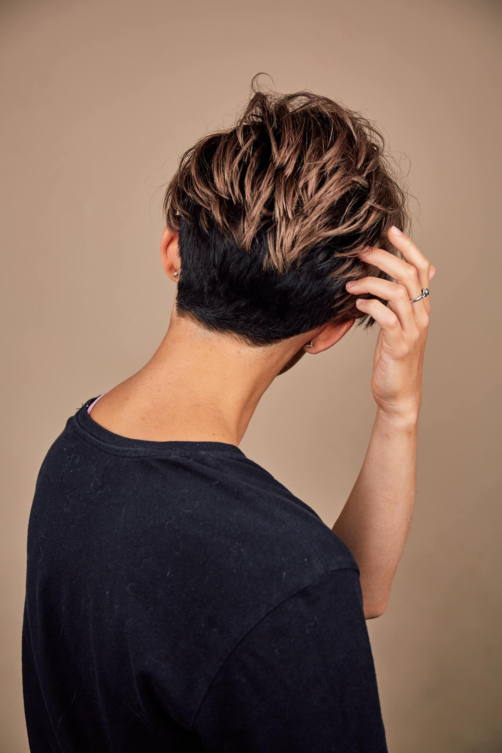 Kpop inspired hairstyle: person with very short golden brown hair