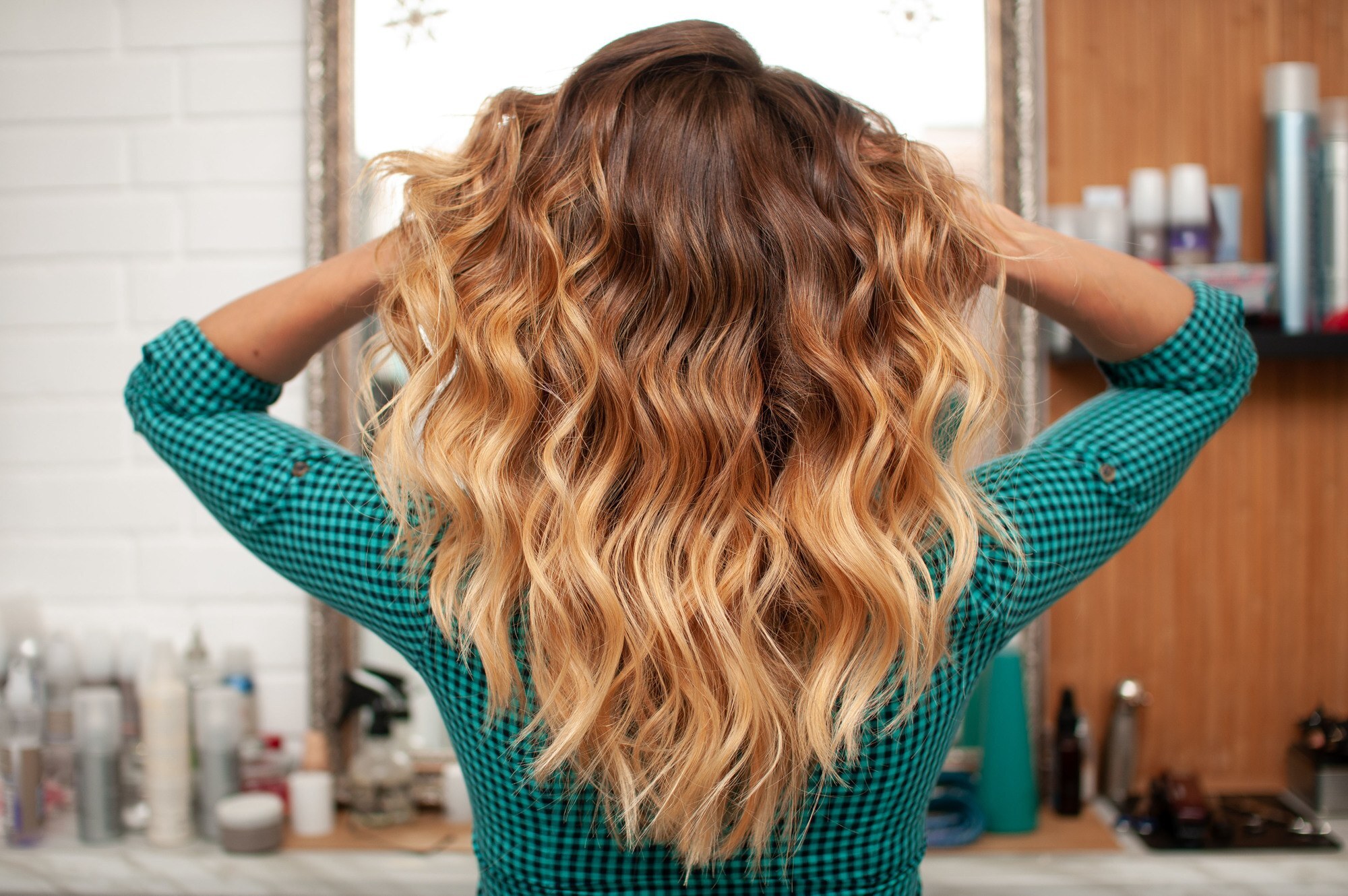 woman with long wavy hair and ombre colour