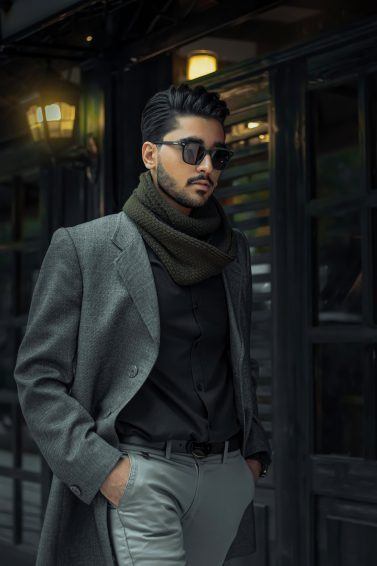 Man wearing shade and a suit with gel in his hair