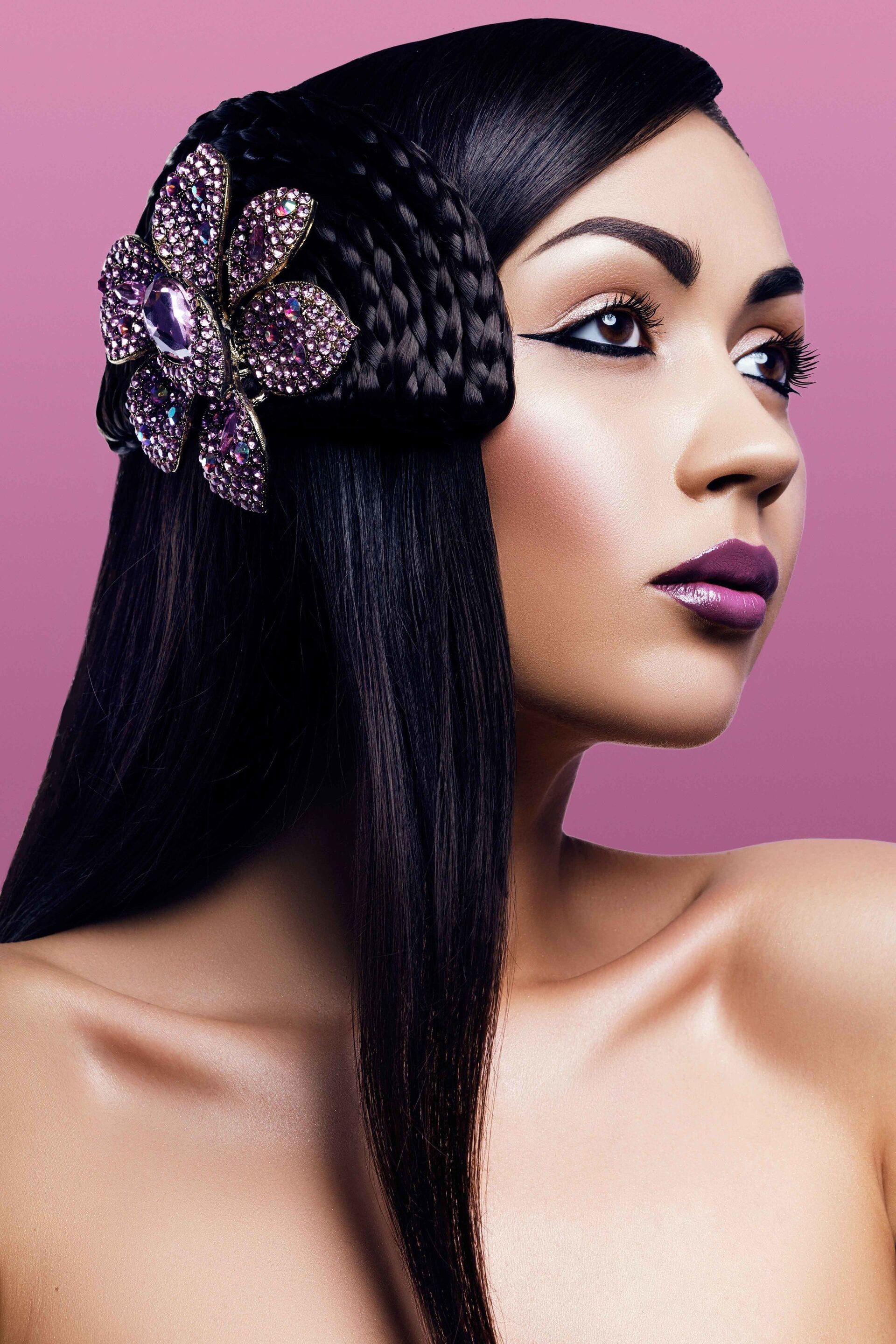 long sleek black hair with big purple accessory sun met hairstyle