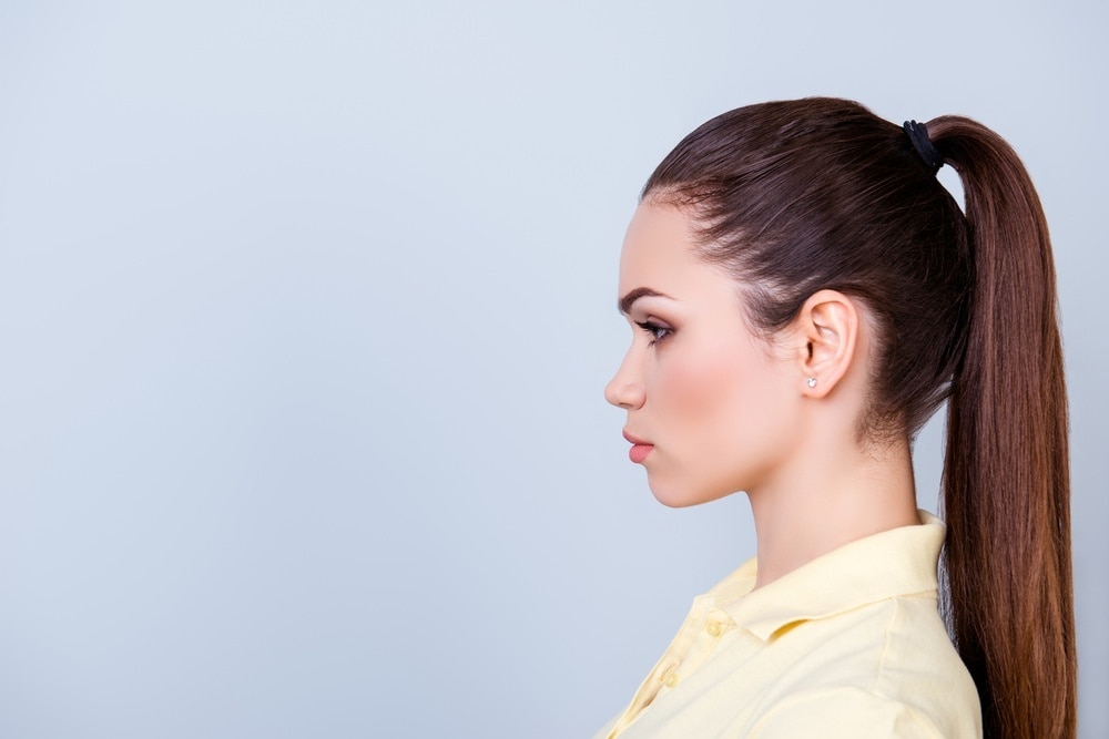 hairspray hacks: woman with a sleek ponytail