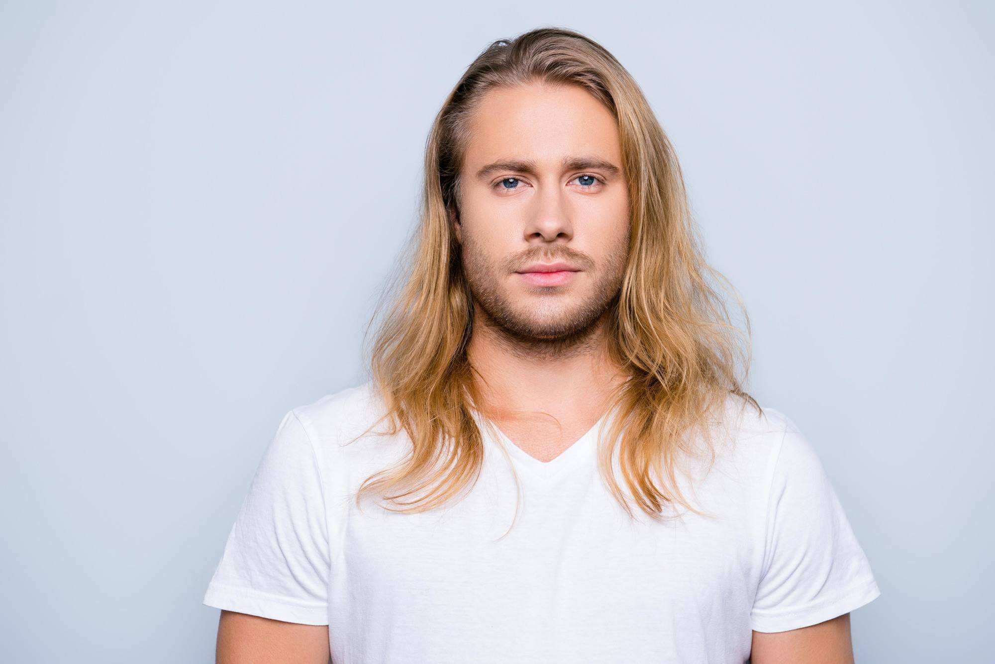 men with round faces: Man with long slightly wavy blonde hair