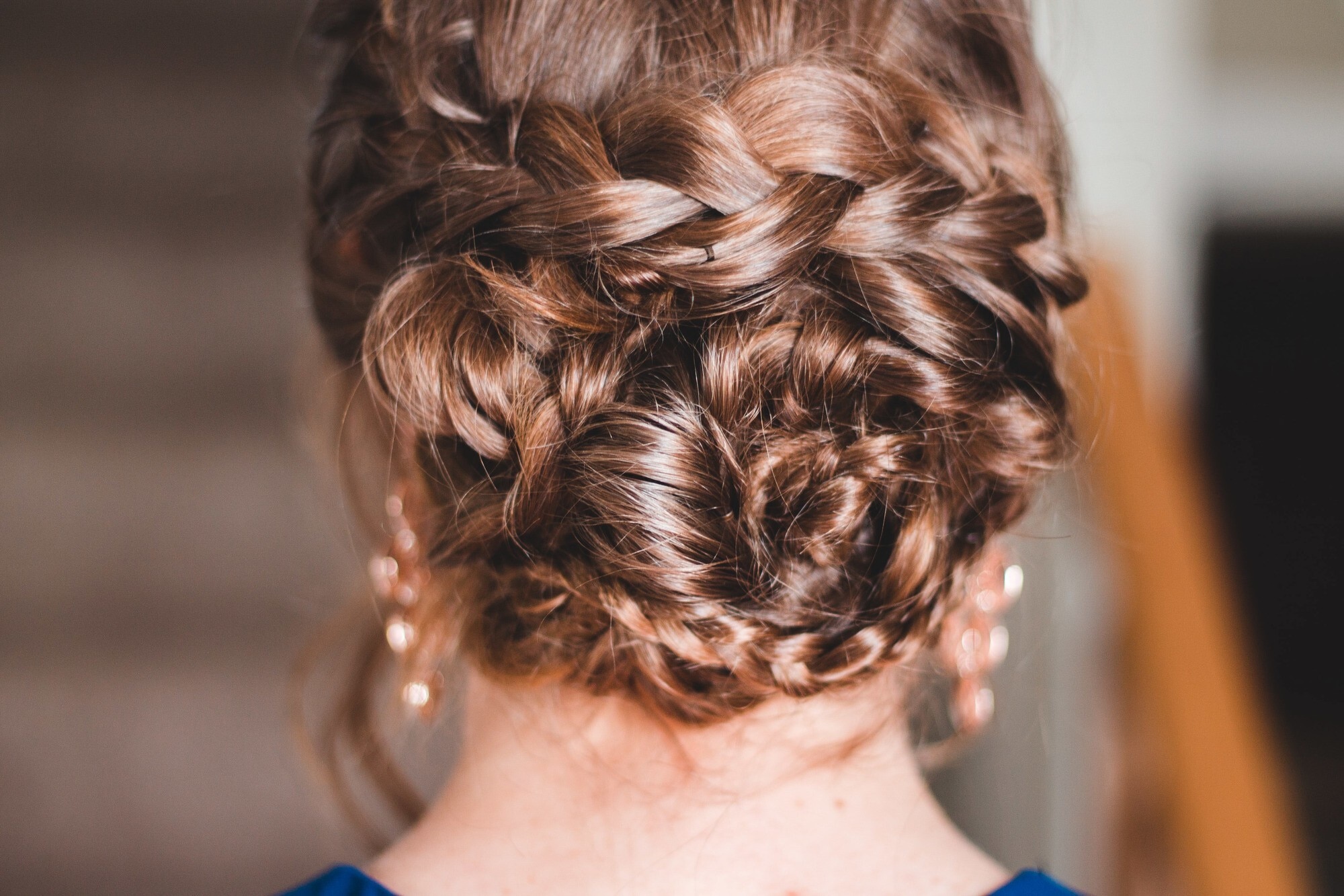 greek-inspired hairstyle: closeup shot of a braided bun hairstyle