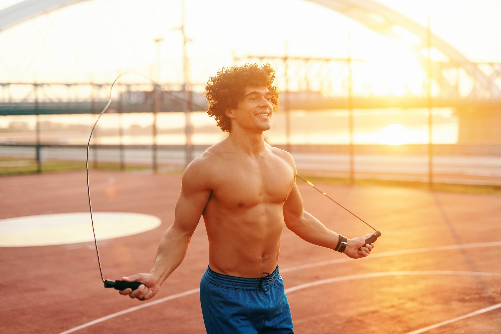 Man with bouncy curls and a skipping rope