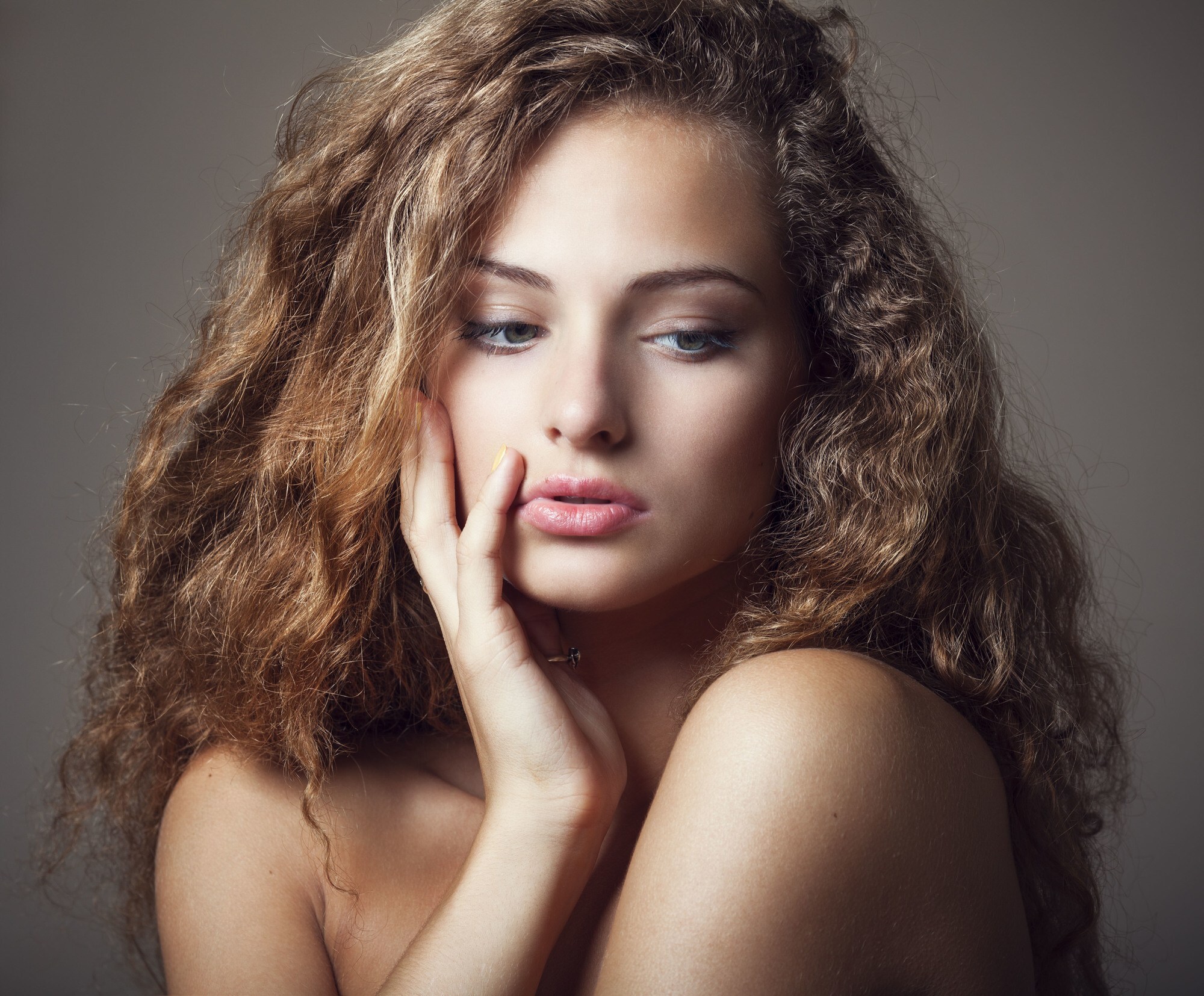 winter flyaways: woman with long brown frizzy hair
