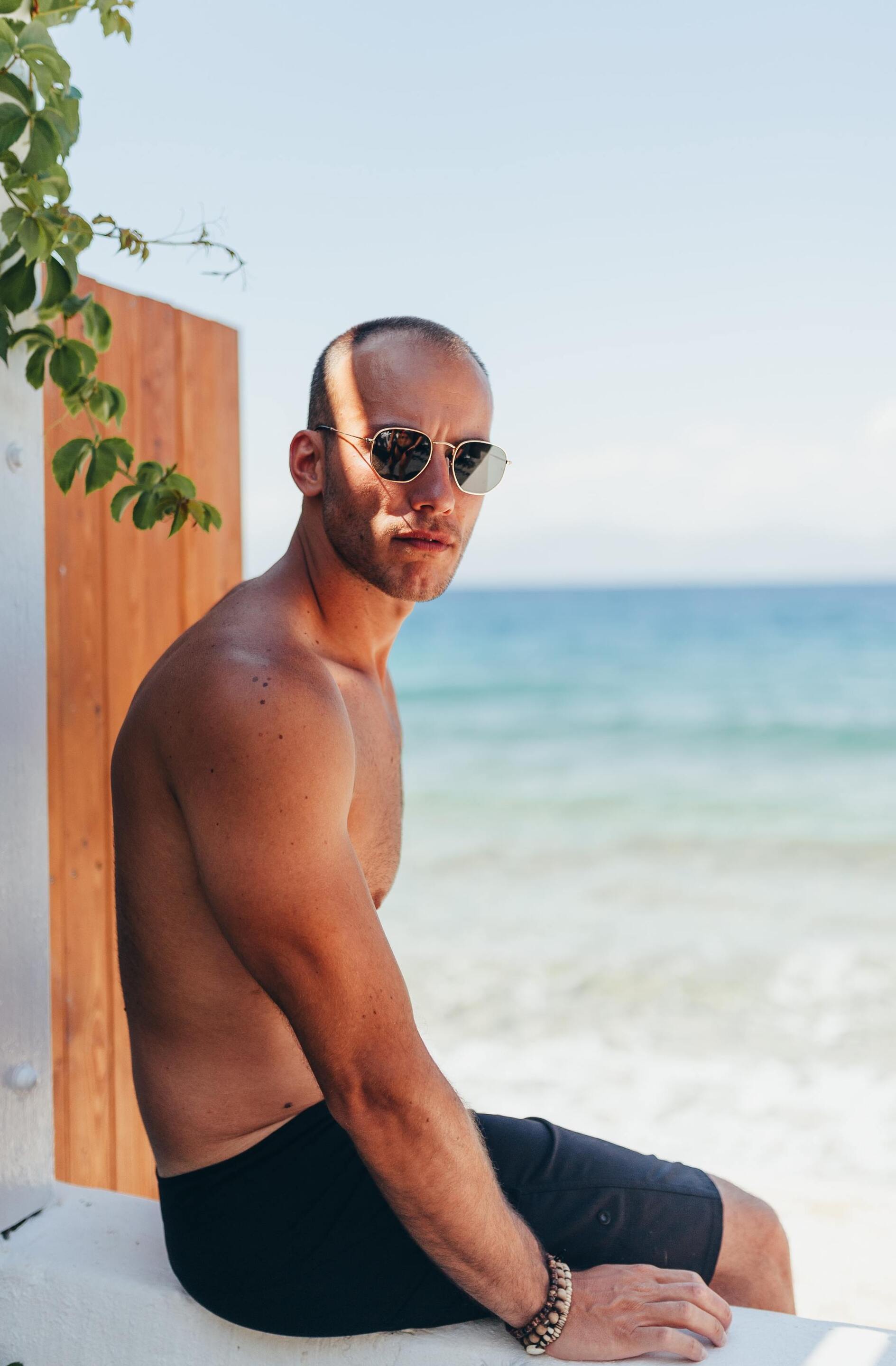 fuss-free men's hairstyles: Man at the beach with a buzzcut