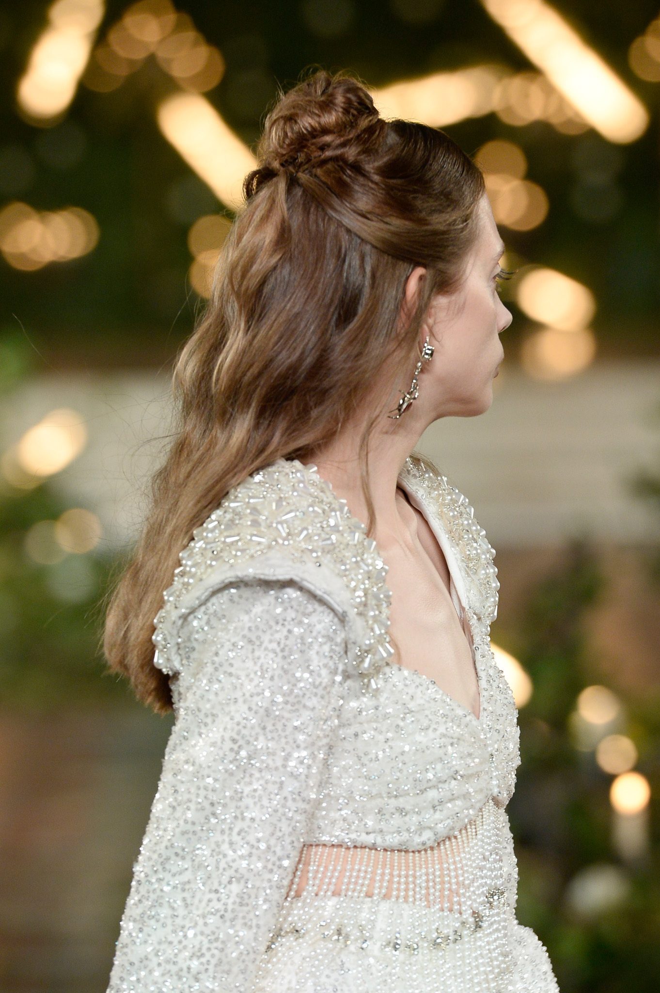 NYFW half up top knot with wavy hair