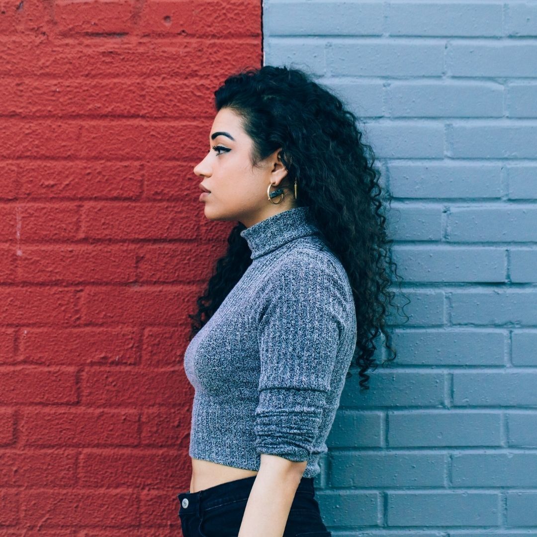woman with long black naturally curly hair