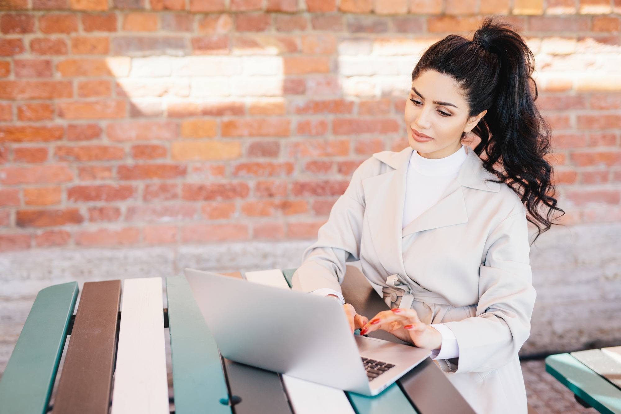 woman on video calls with a high ponytail hairstyle