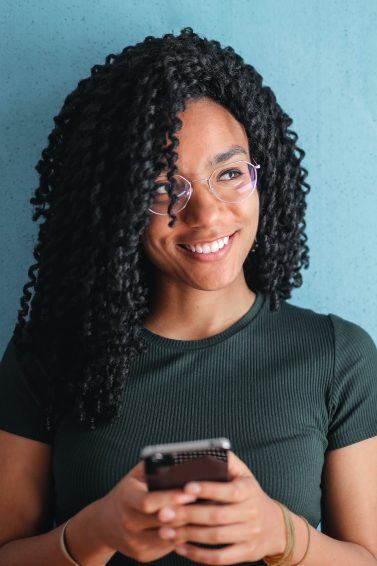 Black Friday Wishlist: woman shopping on her phone