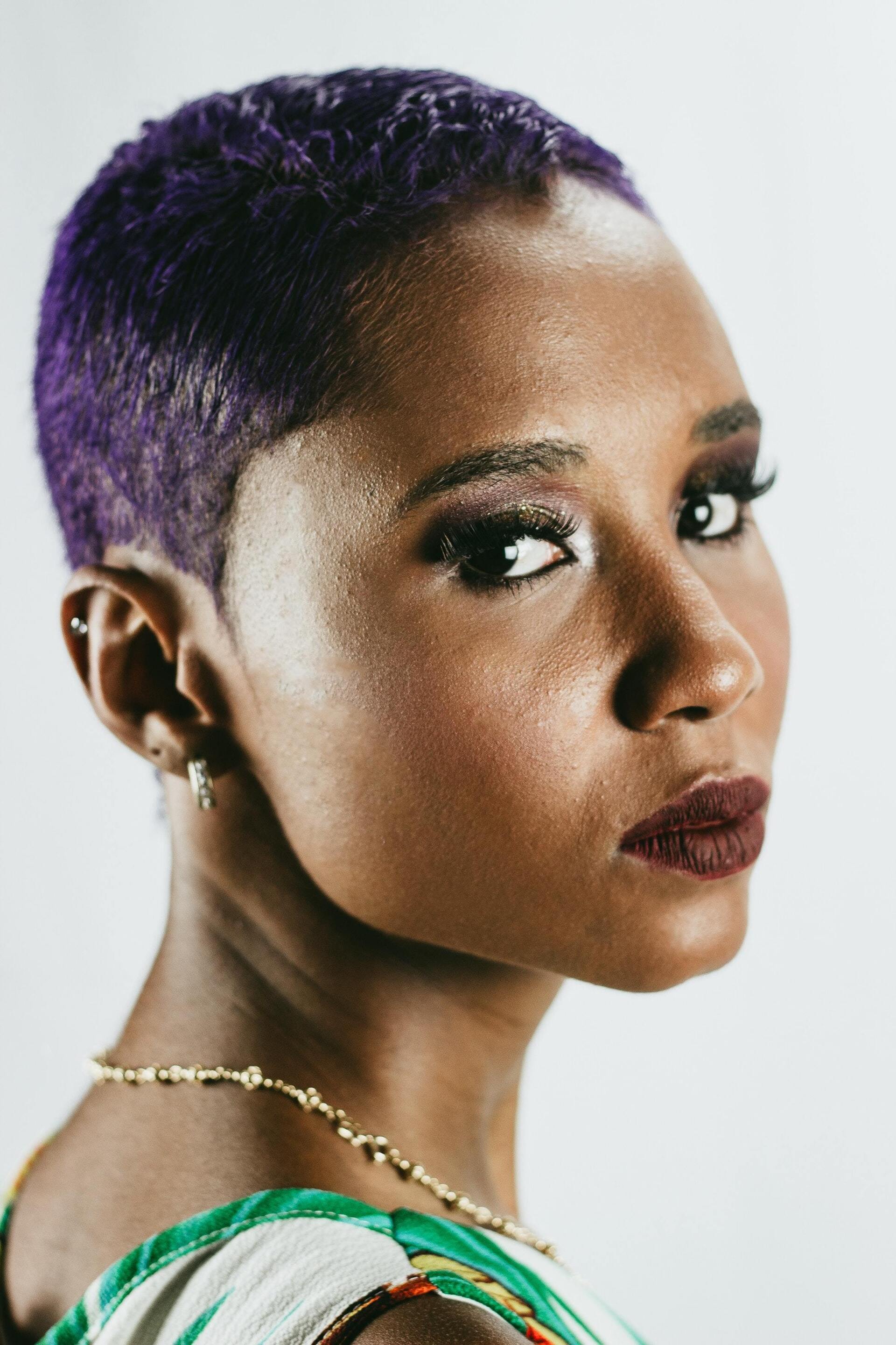 hair gel: woman with purple, slicked-down buzzcut hairstyle