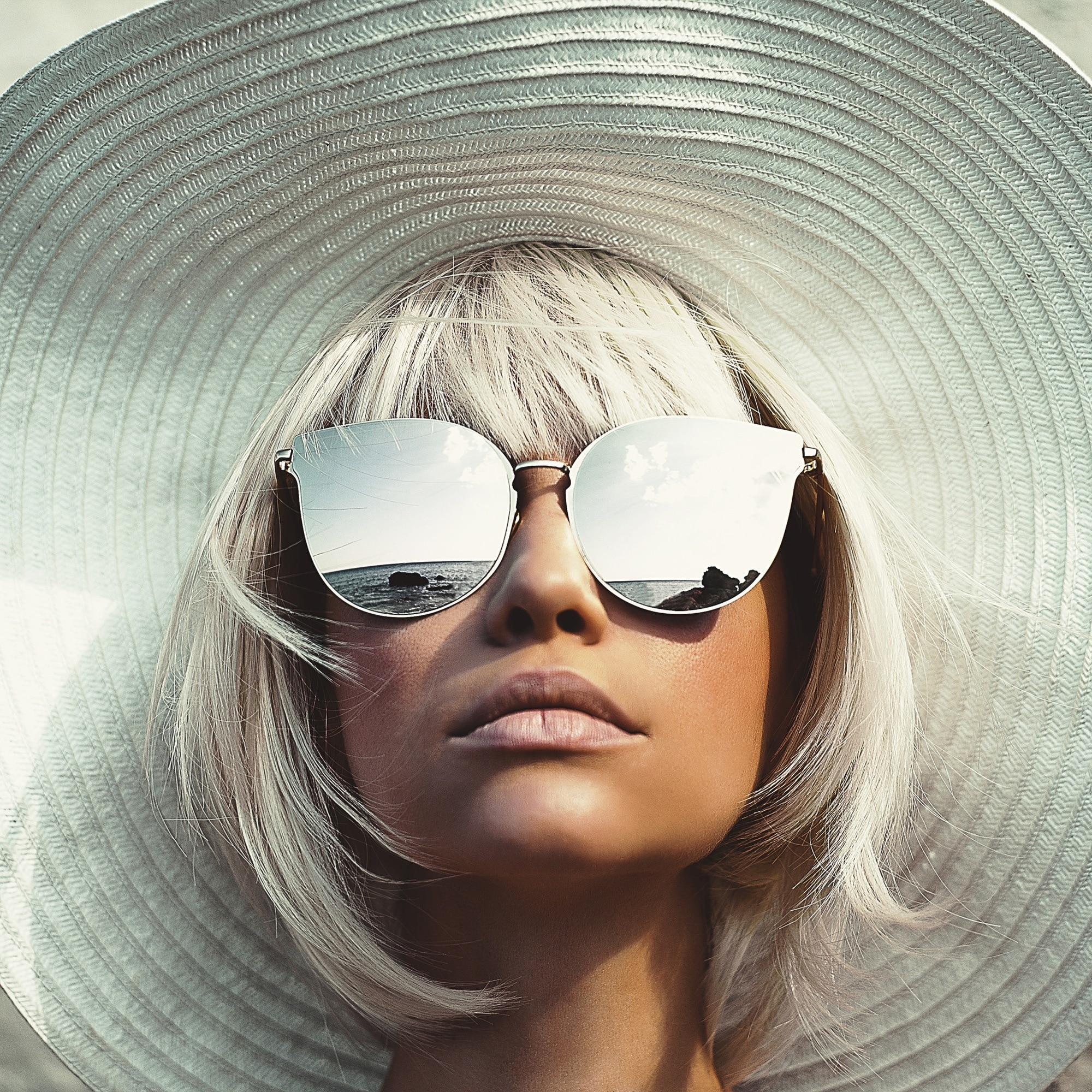 Blonde hair with bangs and hat