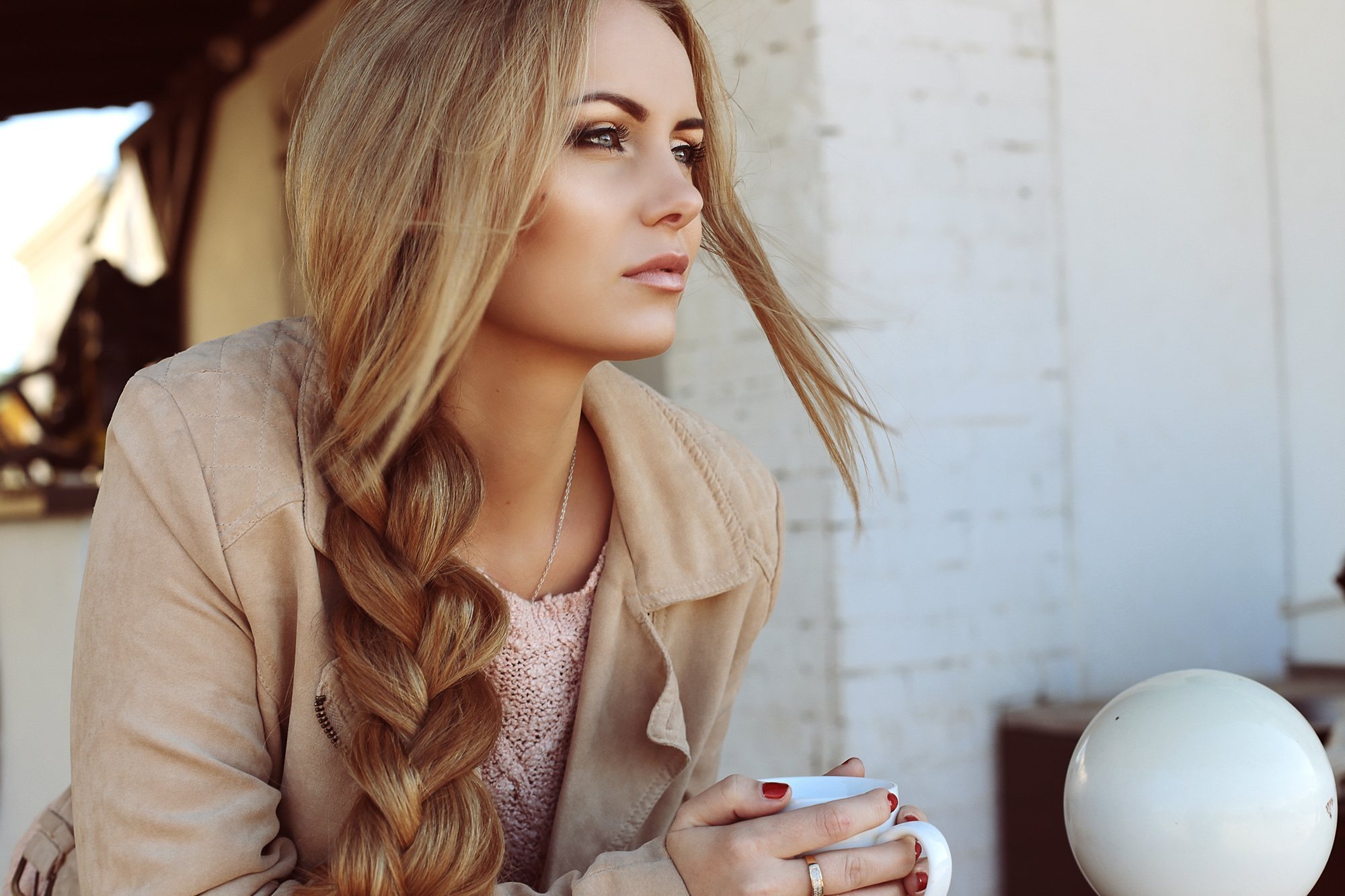 woman with loose side braid blonde hair