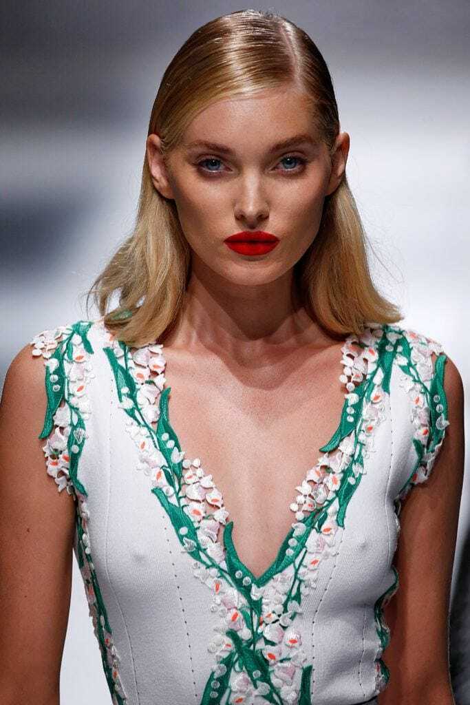 Straight hairstyles: Model with blonde long bob styled in a side-parting with a high shine finish at Blumarine show.