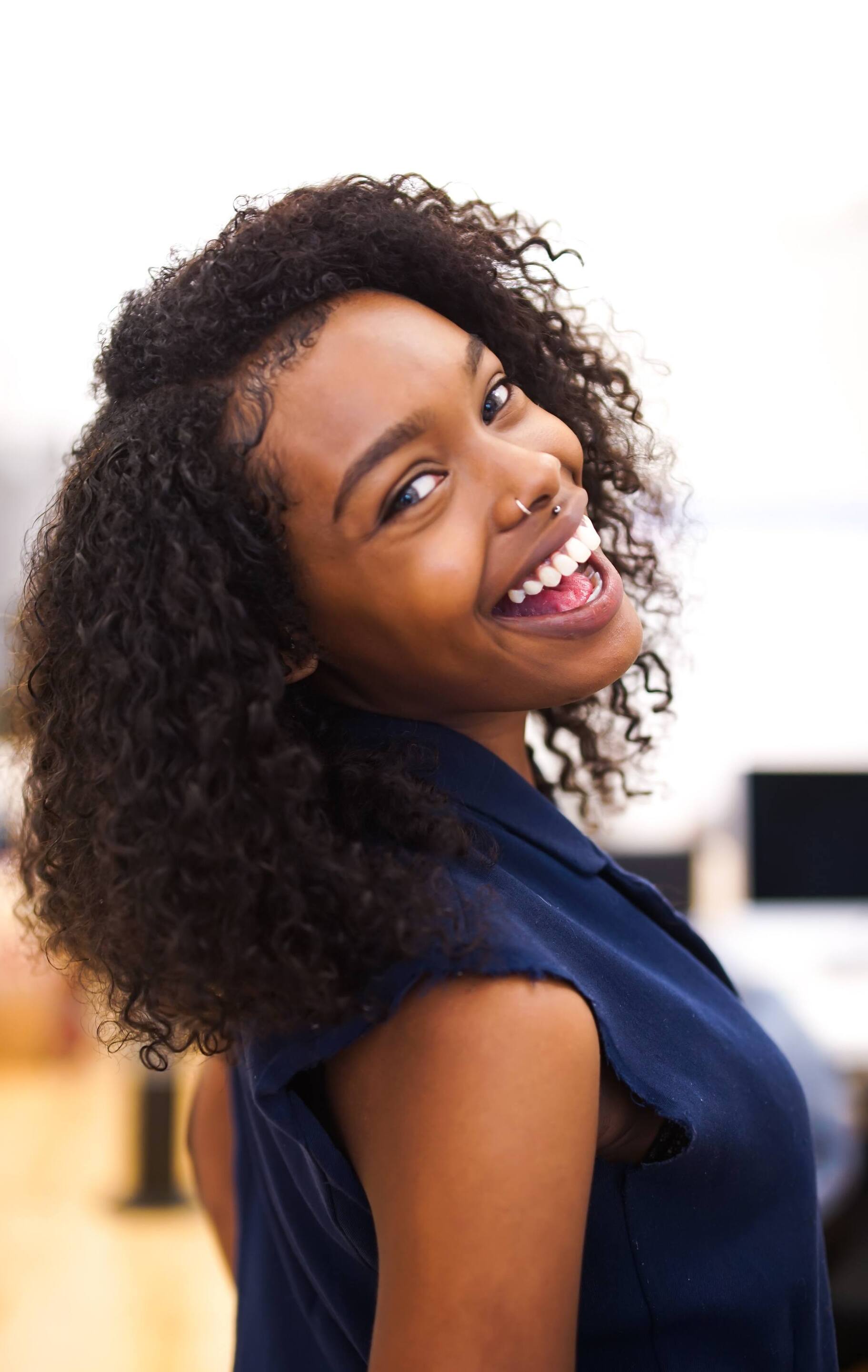 woman with a stretched curly hairstyle