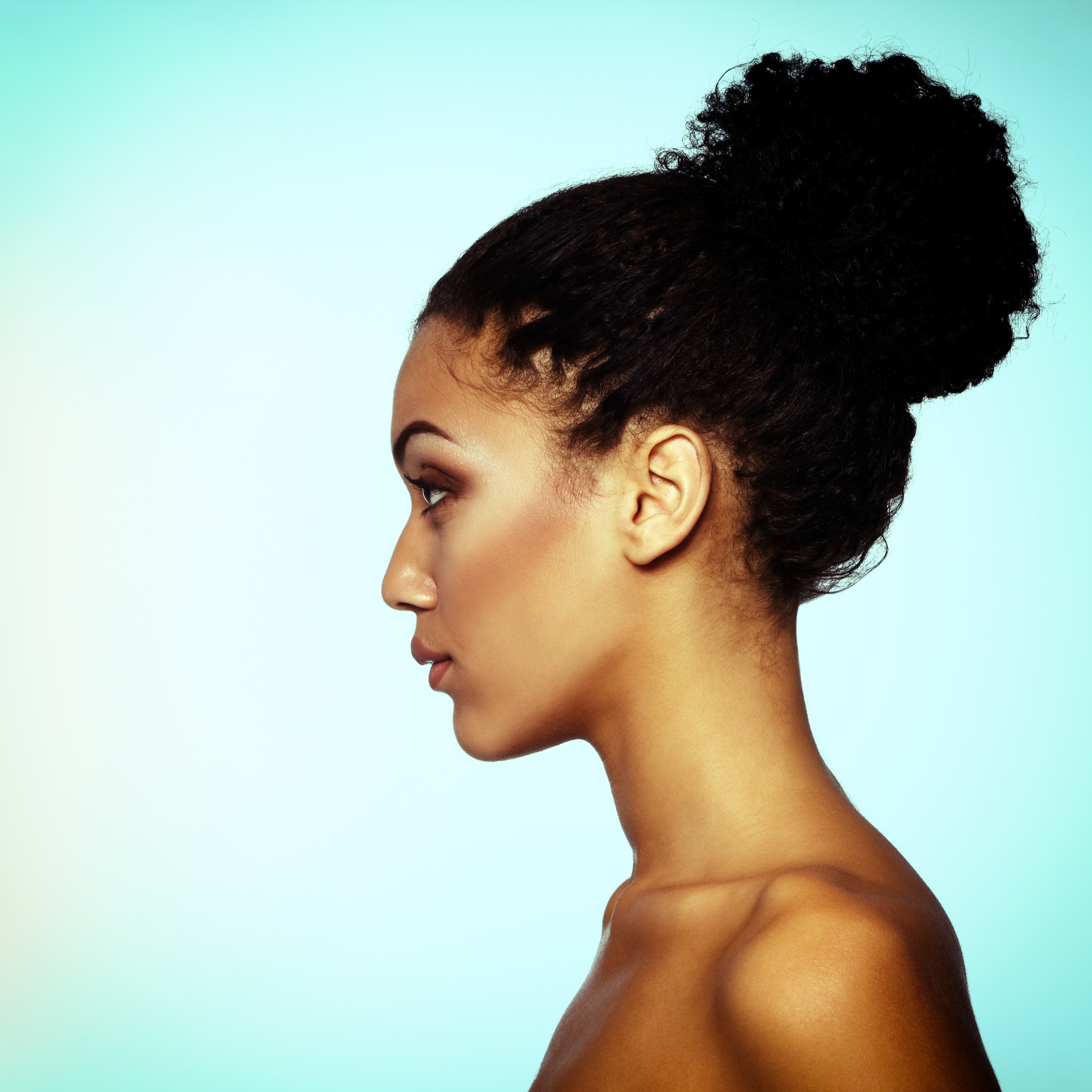 black natural hair with a high bun