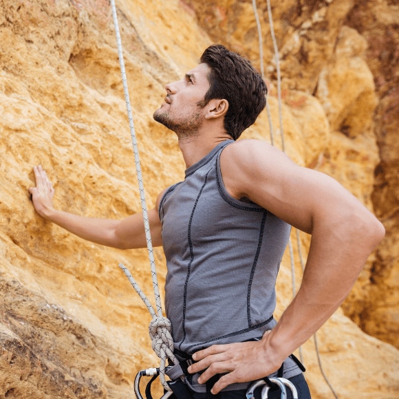 Young active man in proper sports gear avoiding armpit rash from deodorant