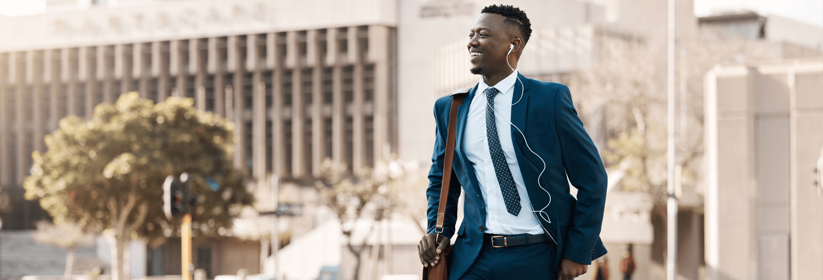 Young confident African American man walking to work with confidence and no anxiety sweat