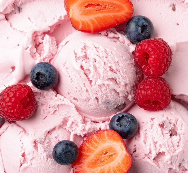 Scoops of Breyers Natural Strawberry and fresh fruit 