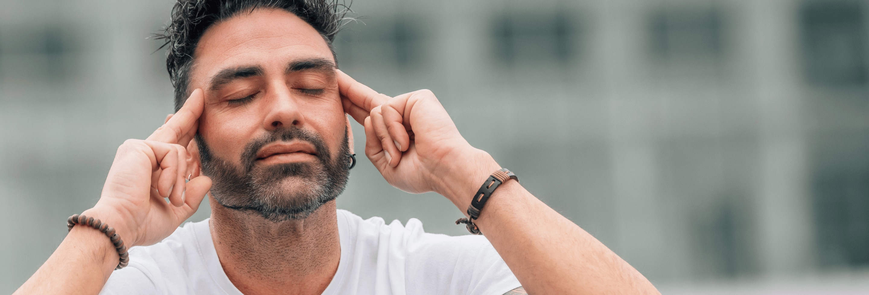 Man meditating to destress to help stop his sweat from smelling like ammonia.