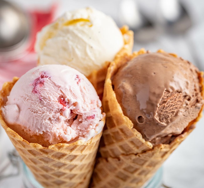 Ice cream cones with different flavored scoops