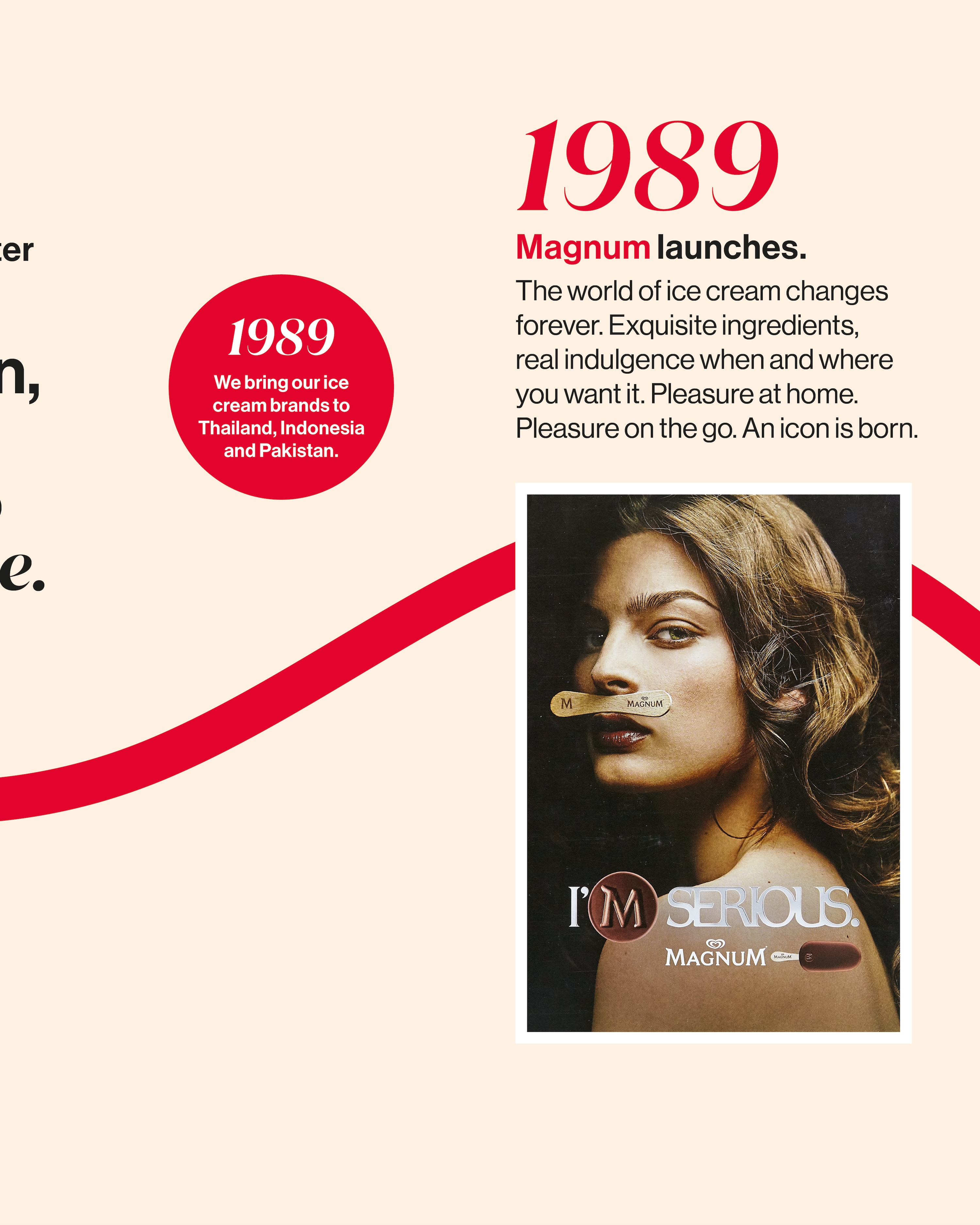 Elegant woman with wavy hair balancing a Magnum ice cream stick on upper lip