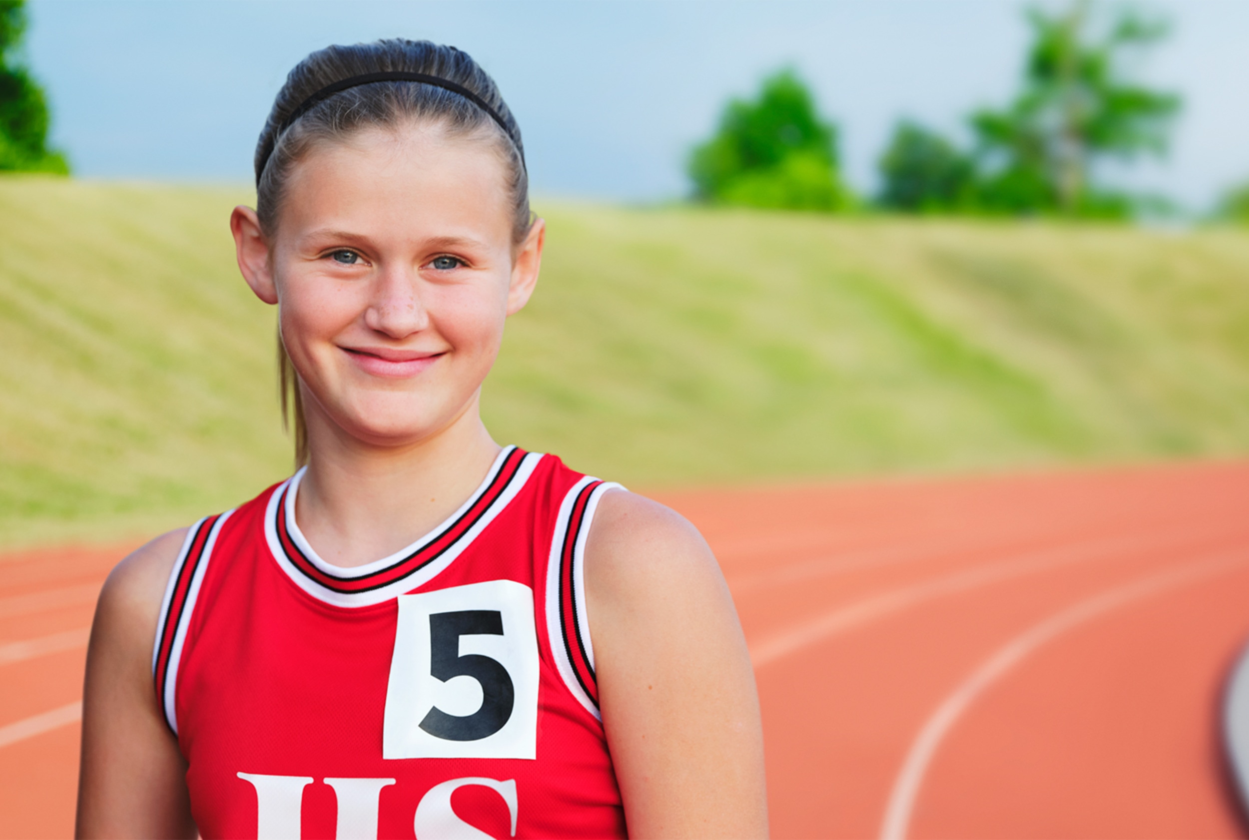 Girl smiling on track field