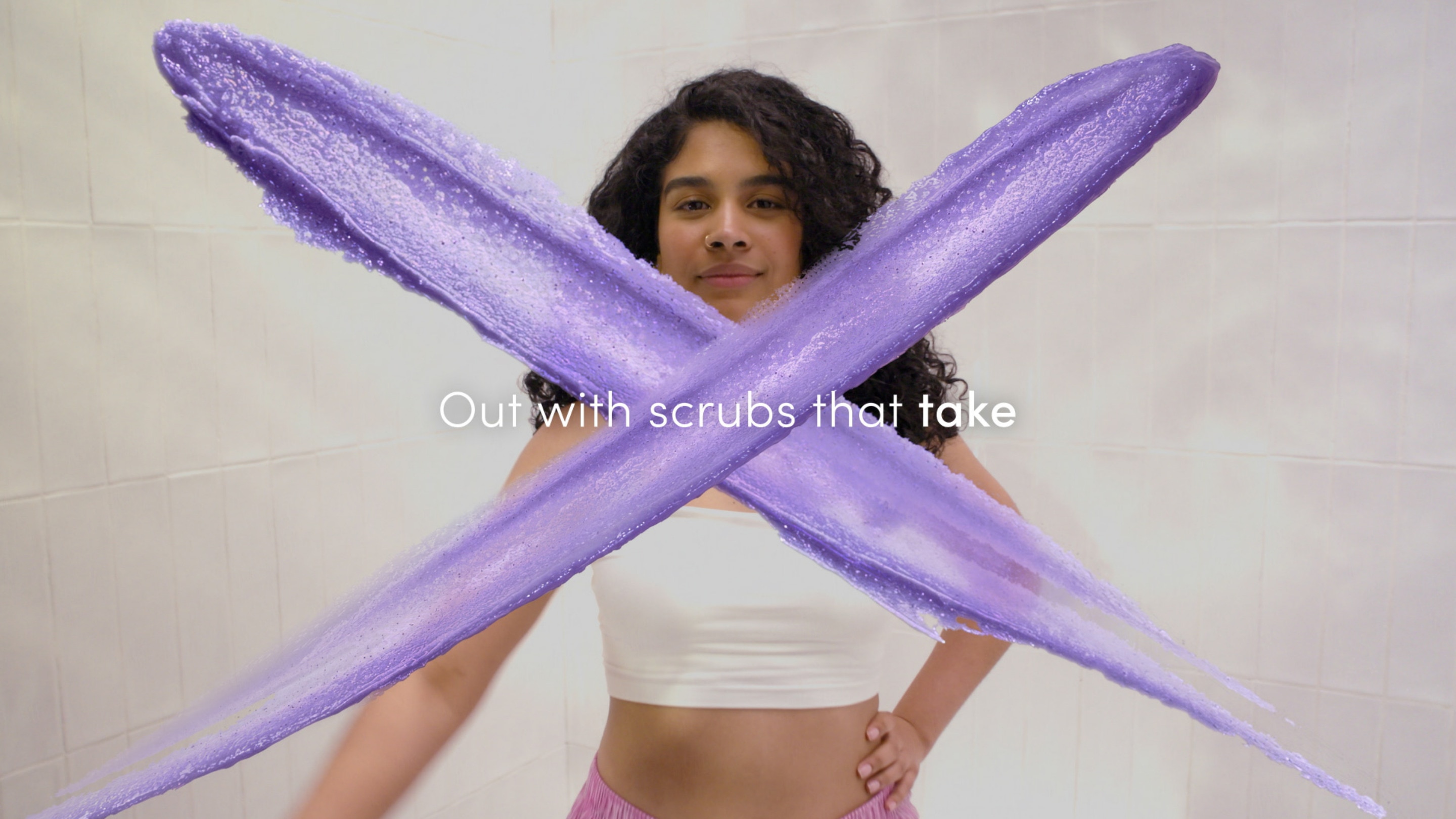 Person applying the Dove Body Scrub in the shower