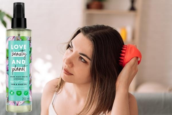 Top Benefits to Using Hair Oil for Hair Growth This Summer woman long brown hair