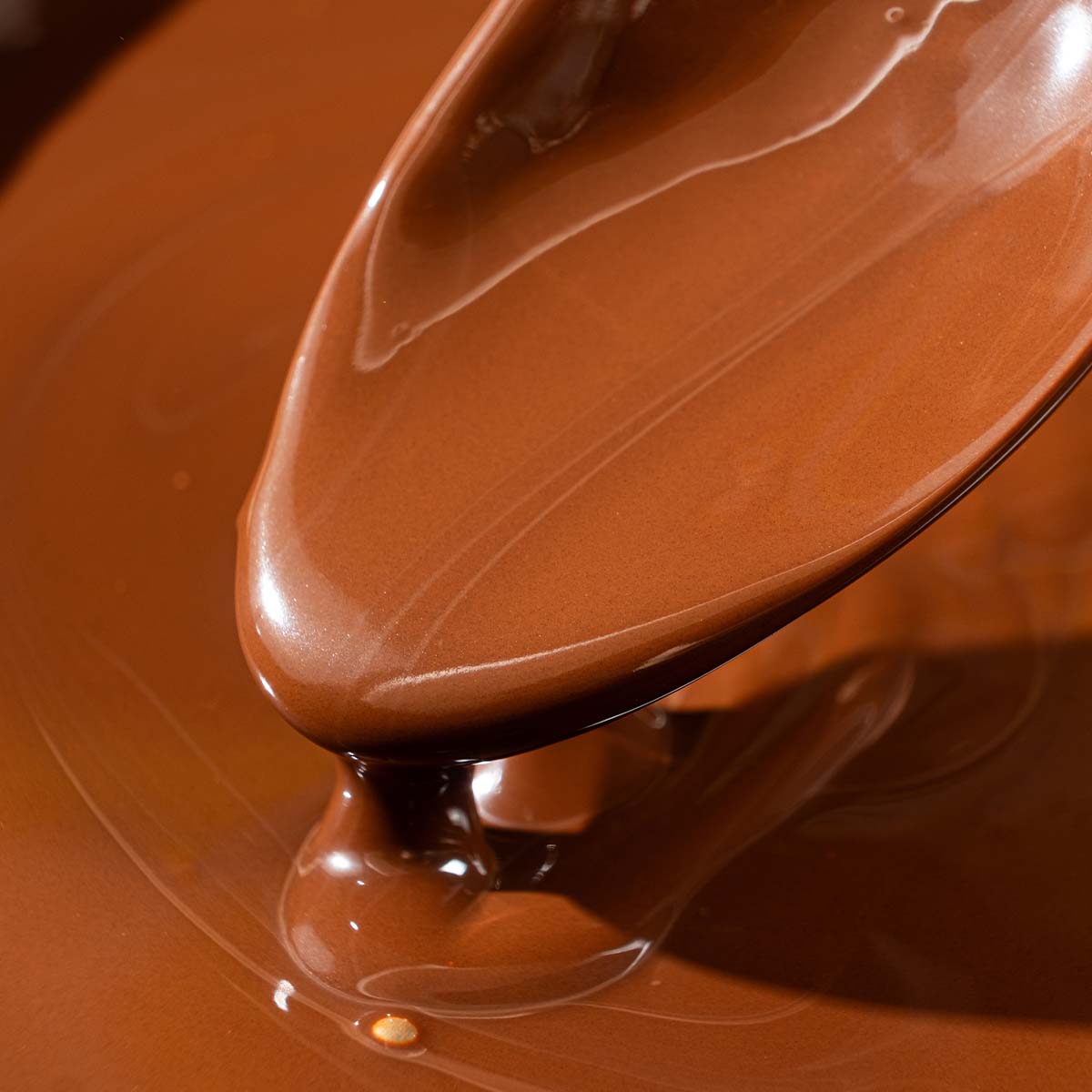 Melted chocolate on a spoon.