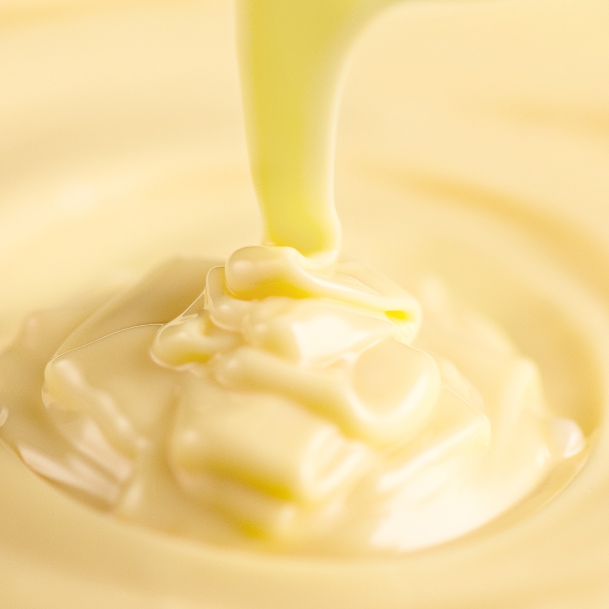 Swirl of melted white chocolate.
