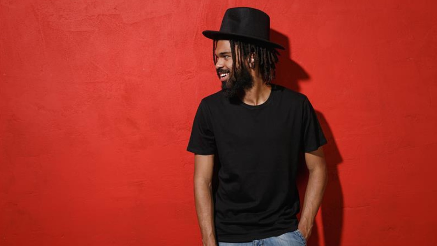 Young African American man wearing a hat with no sign of sweat stains