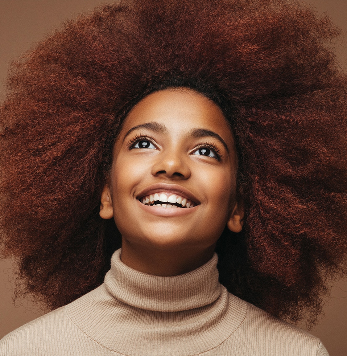Girl with afro hair smiling