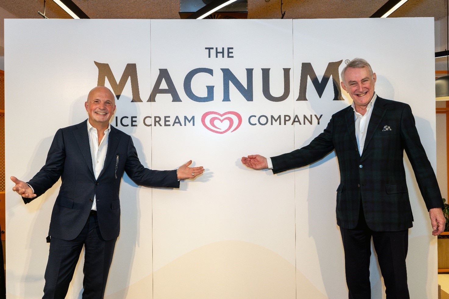 Jean-François van Boxmeer, Chairman-designate of the Ice Cream business (right) and Peter ter Kulve, President of the Ice Cream business (left) in front of The Magnum Ice Cream Company logo