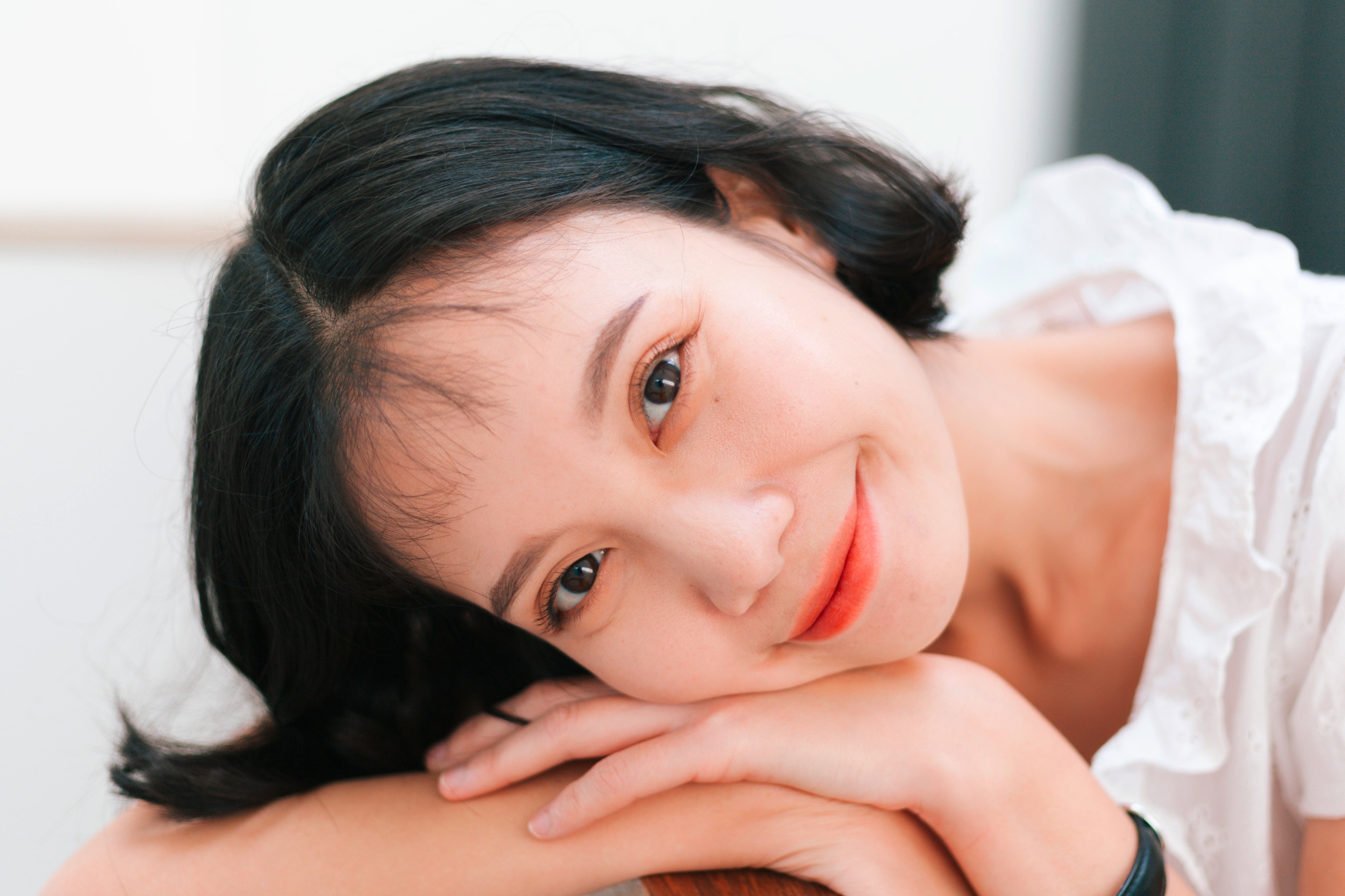 Smiling woman with short hair staring at the camera.