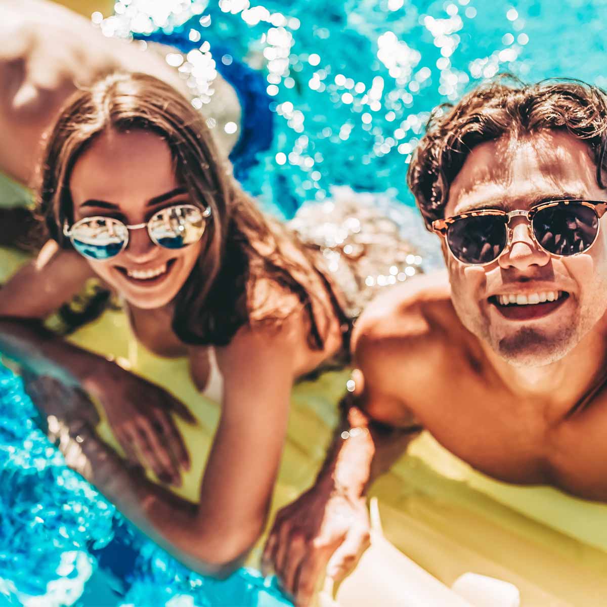 Couple of friends hanging out in the pool