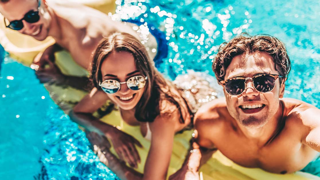 Couple of friends hanging out in the pool