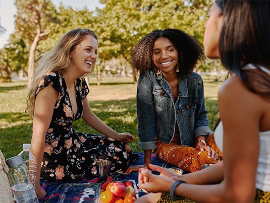 Friends having fun at a picnic in the park