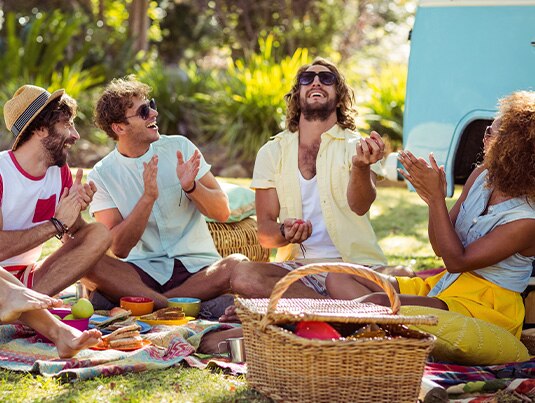 Friends having fun at a picnic in the park