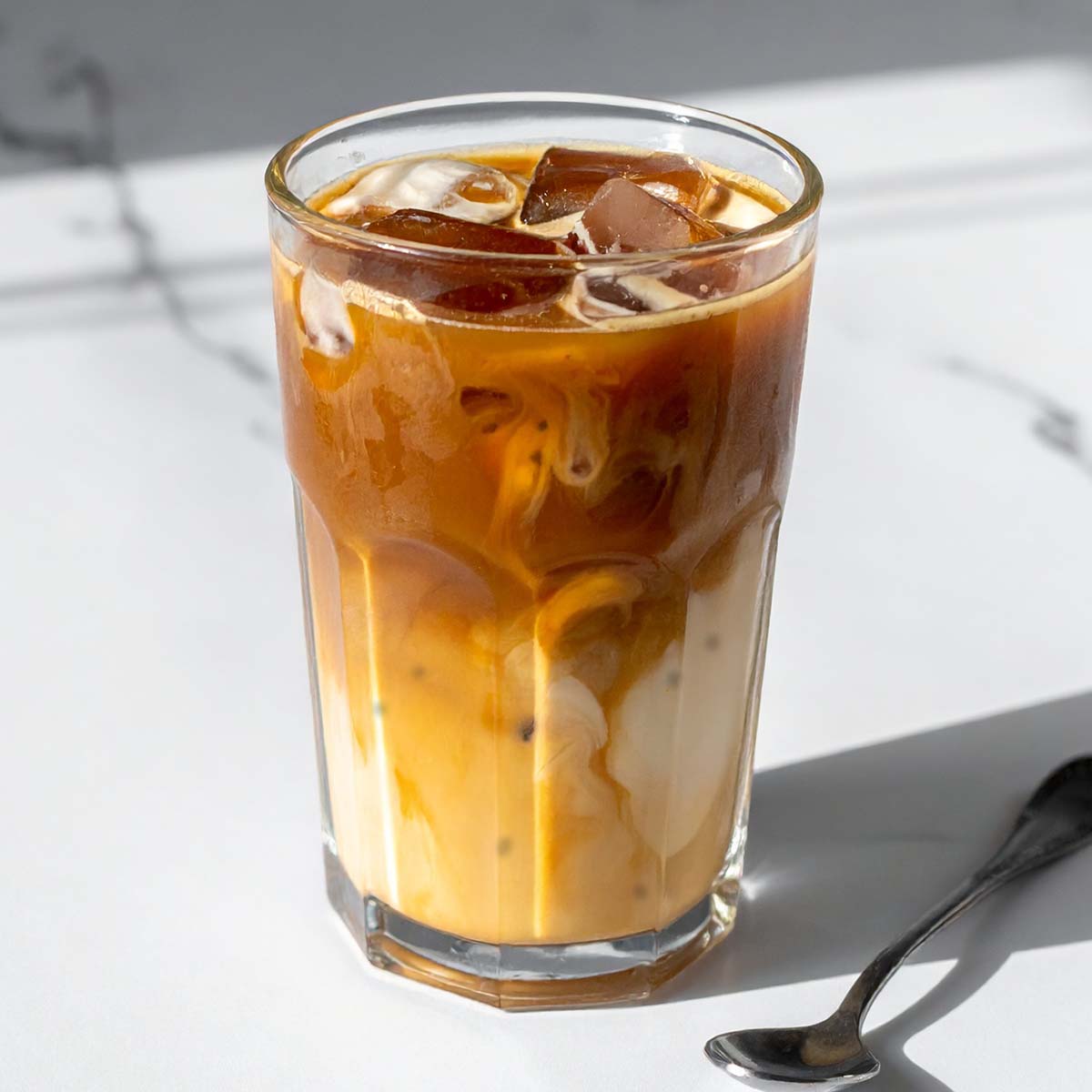 Glass of Iced Latte flavored with Talenti Caramel Cookie Crunch Gelato