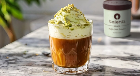 Glass of pistachio affogato with a pint of Talenti Pacific Coast Pistachio Gelato in the background