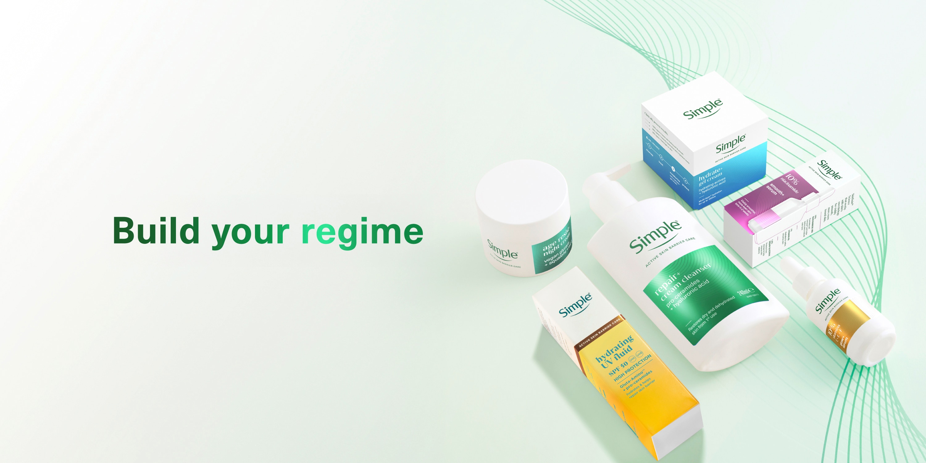 Text reads “Build Your Regime” with a collection of Simple skincare products including cleansers, serums, and moisturisers in white bottles with coloured labels against a light background.