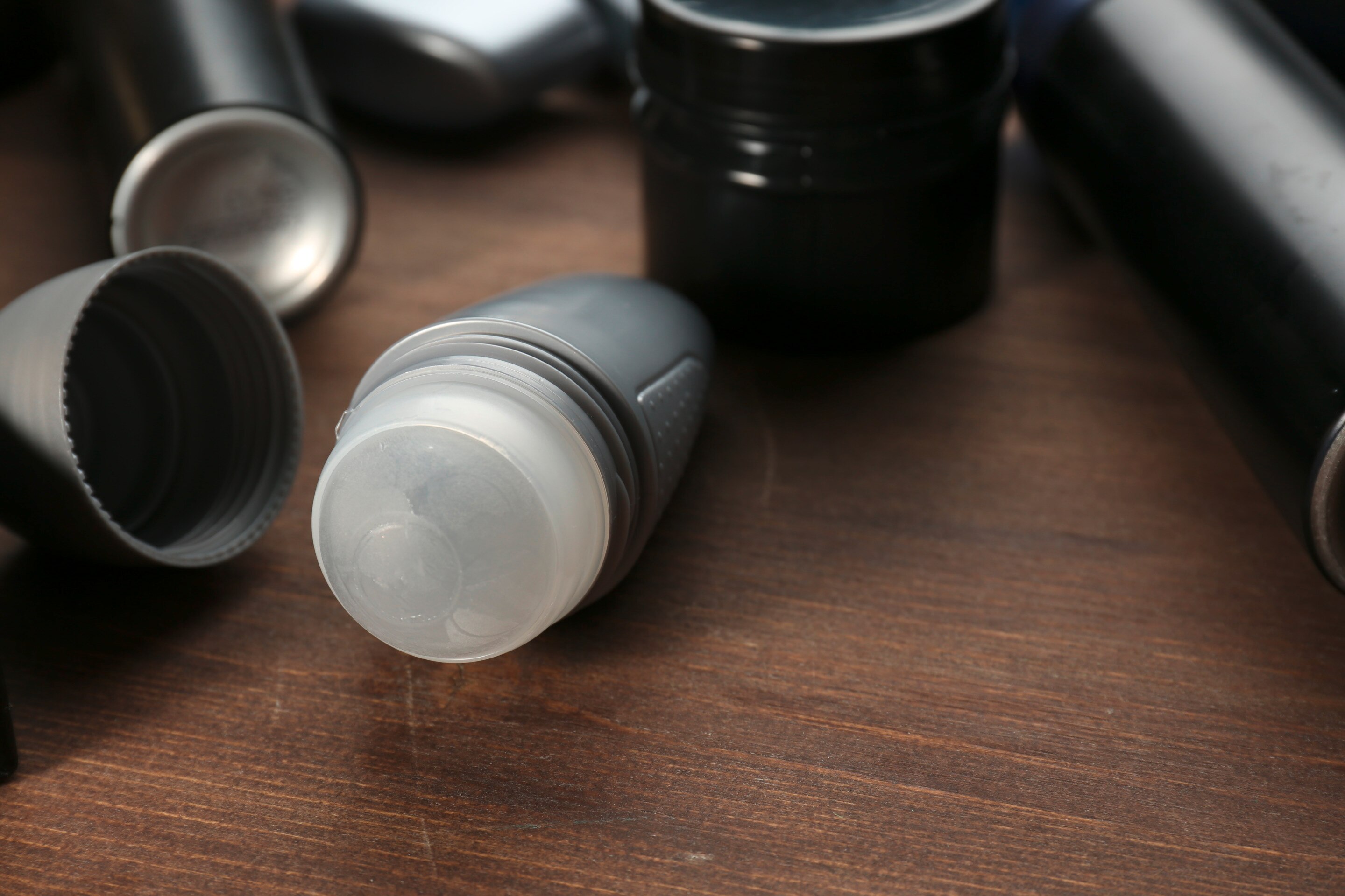 Roll-on deodorant on a wooden table.