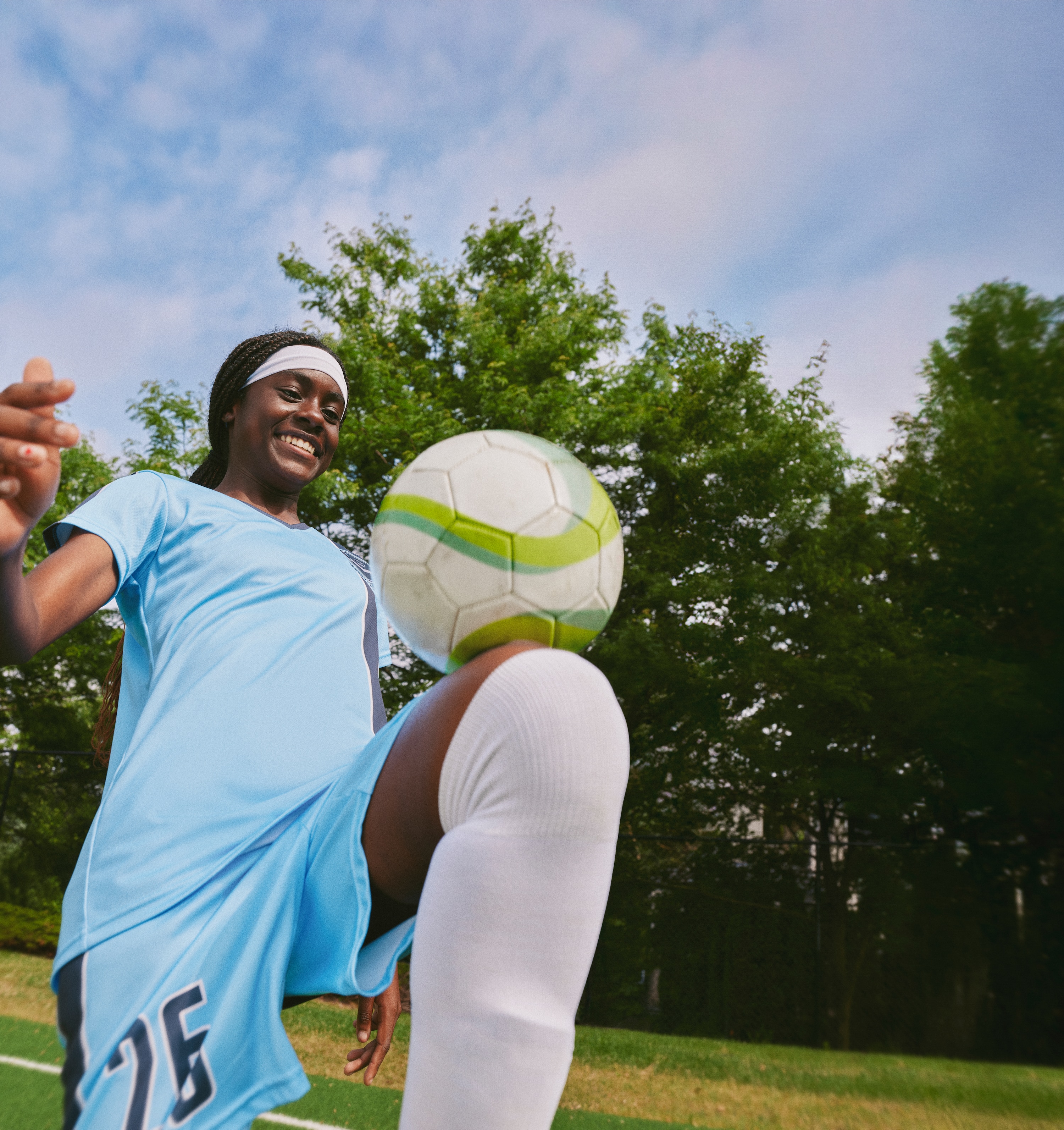 An image of a diverse group of people. They are smiling and look happy.