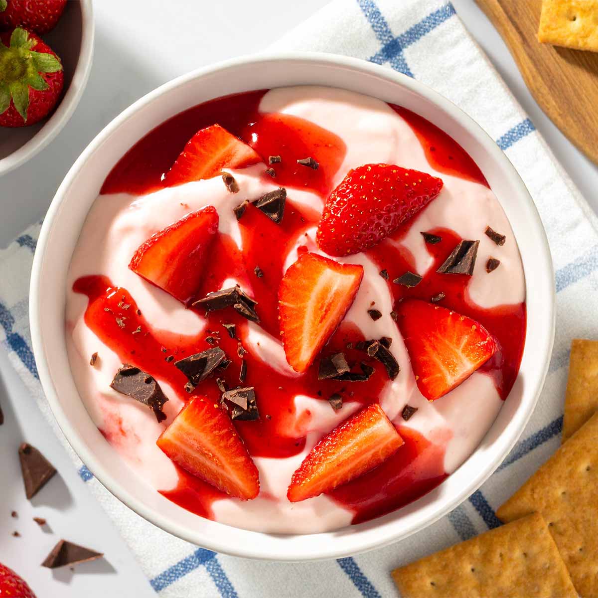 Strawberry cheesecake dip with Klondike bar chunks and strawberry slices.